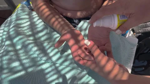 Sun cream concept, Applying sun cream, body milk to children boy in sunny t.. Stock Footage 256245264