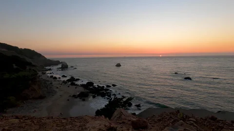 Sun cresting the horizon at sunset along the California coast from the Stock Footage 138922754