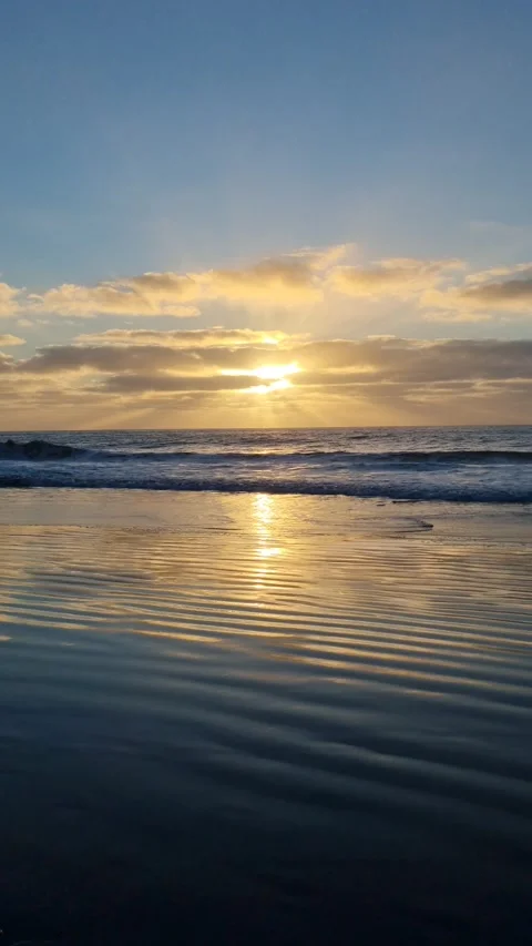 The sun dips below the horizon in Tenerife, casting vibrant colors  Stock Footage 307632732