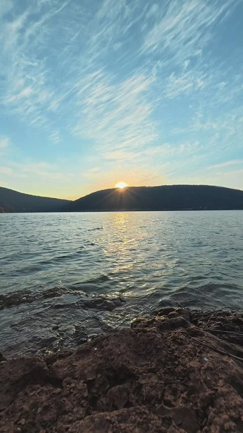 Sun dips low, painting sky with soft golden hues. Balkan, Eastern Europe, POV Stock Footage 333634377