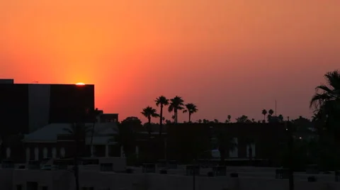The Sun Disappears Behind a Building but its Glow Continues Stock Footage 61839886