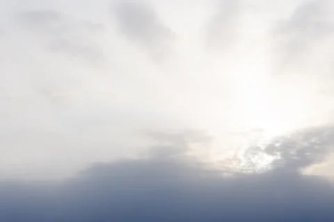 The sun disappears behind the clouds . Stock Photos