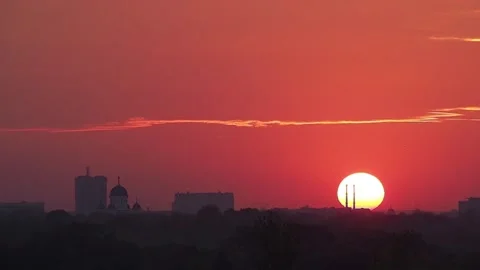 Sun disc descending at sunset in bucharest, romania Stock Footage 311778296