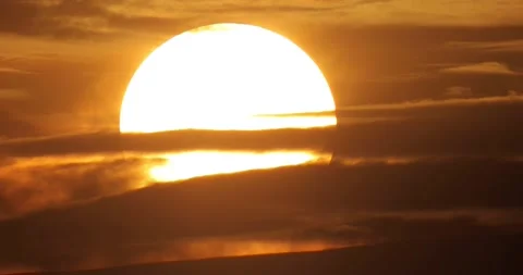 Sun Disc Sinking through Clouds in Orange Sunset Timelapse Vídeos de archivo 134459300