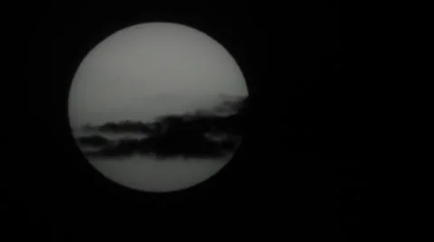 Sun disk behind line cloud Stock Footage 33219178