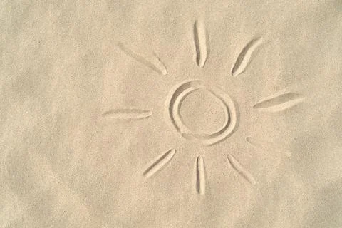 Sun drawn on the sand with copy space,Summer concept Stock Photos