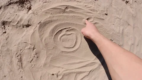 The sun drawn on the sand Stock Footage