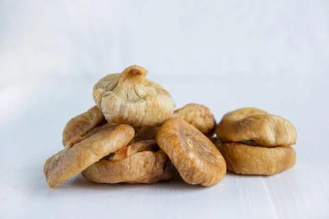 Sun-dried figs close-up on a light background. Healthy snacks Stock Photos