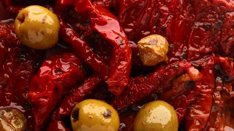 Sun-dried pickled tomatoes with green olives and capers, rotation in circle Stock Footage 237438140