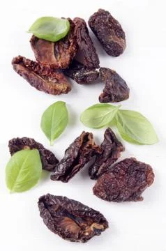 Sun dried tomatoes and basil Stock Photos