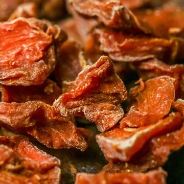 Sun-dried tomatoes in a close-up view showing texture and color Stock Photos