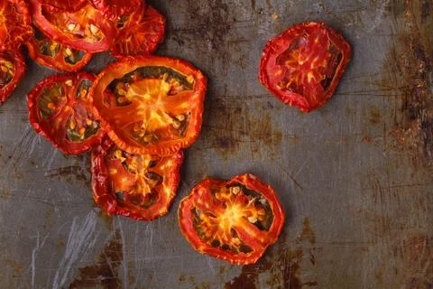 Sun dried tomatoes on dark rustic background Stock-Fotos