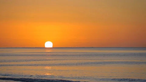 Sun dropping down over the ocean Stock Footage 126451060