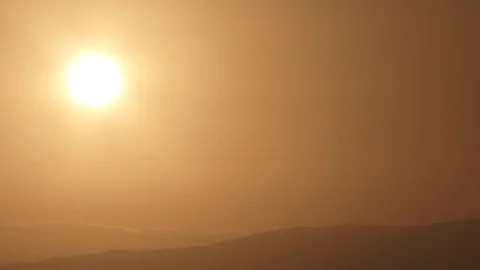 Sun Dropping On Warm Sky Behind Cloud And Land Timelapse 스톡 동영상 107289945