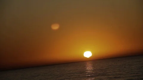 The sun drops into the sea Stock Footage 123201336