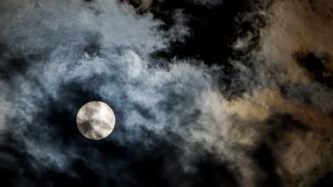 The Sun during the day behind the clouds Stock Photos