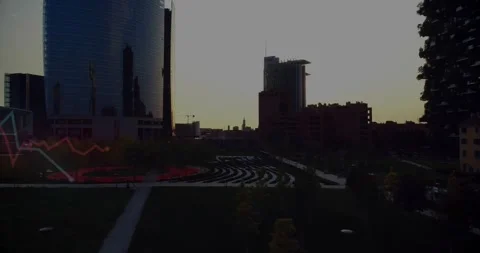 Sun emerging behind central midrise casting glare, glinting glass, revealing Stock Footage 322204339