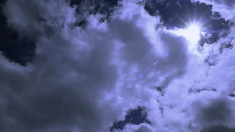 Sun Emerging Through Fluffy Timelapse Clouds Stock Footage 278431924