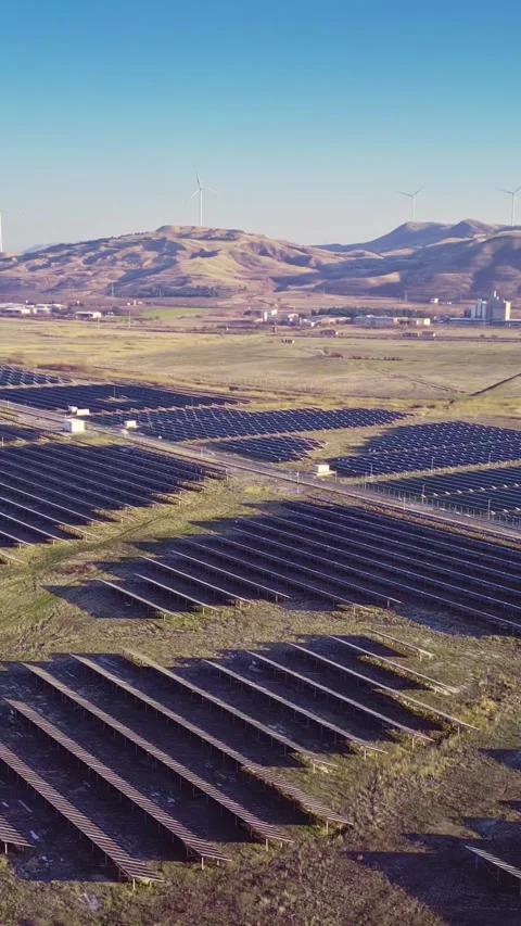 Sun energy utilisation, cultivated land and solar field, vertical phone Stock Footage 283344847