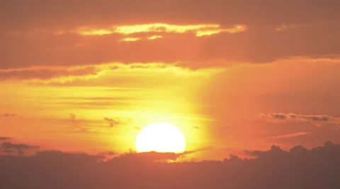 Sun falls out into clouds silhouette time lapse sunset (close) HD 1080 24fps Stock Footage 39886715