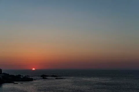 The sun falls on the sea Stock Photos
