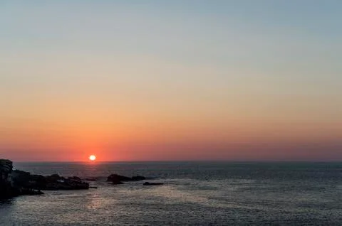 The sun falls on the sea Stock Photos