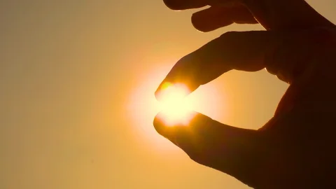 Sun in the Fingers at Sunset, Close Up Stock Footage 96177837
