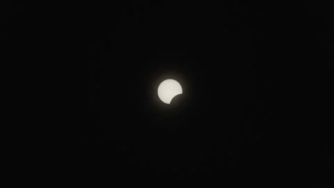 The sun in the first quarter of the partial phase of the total solar Stock Footage 271727592