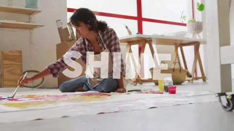 Sun flare arcing frame sparking SHINE overlay while woman artist painting Stock Footage 333925157