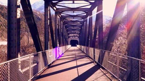 Sun flare. lens flare. walking on bridge. colorful sun Video stock 64538536
