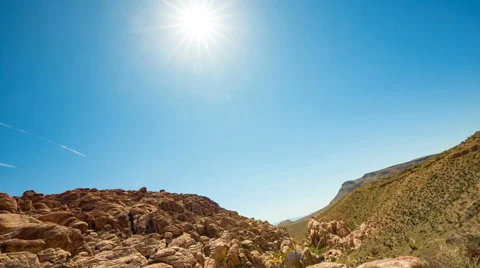 Sun Flare Pan Mountain to Large Boulder Stock Footage 64815919