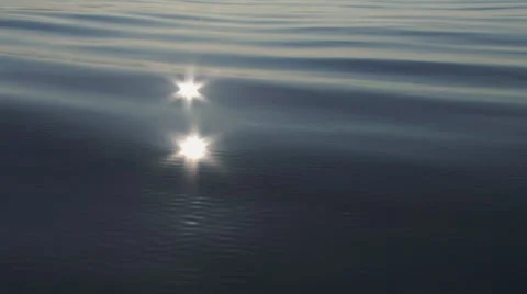 Sun Flare Reflection in Moving Water Waves Stock Footage 8826781