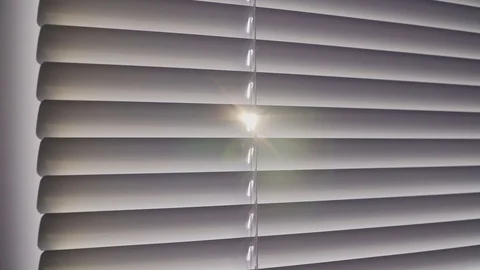 Sun flare through the blinds Stock Footage 102036103
