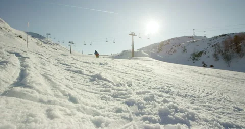 Sun Flared Slow Mo Of Man Skiing Stock Footage 140115447