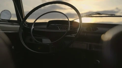 Sun flares shining through steering wheel of old vintage soviet car Video stock 127849945