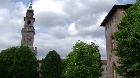 Sun flooding light on trees and Bramante tower, Vigevano, PV, Italy Stock Footage 62480201