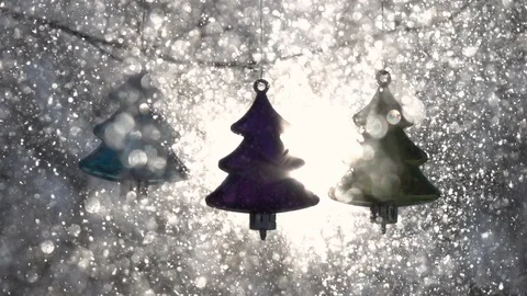 Sun in frame, lens flare and three colored Christmas tree decorative fir-trees Stock Footage 87872394