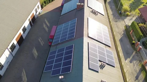 Sun glare reflecting off solar panel rows Stock Footage 292245327