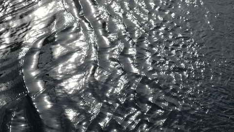 Sun glare on the river or lake water. Rapid river flow. 動画素材 128627346