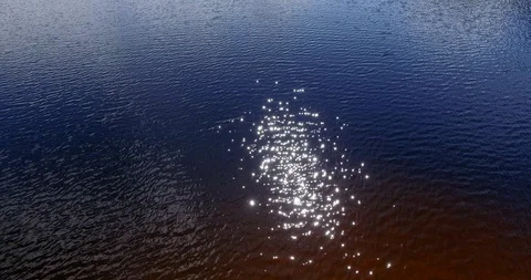 Sun glare on the river or lake water. Stock Footage 129631019