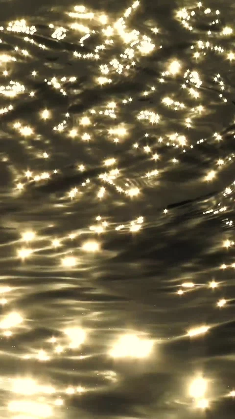 Sun glare in river or ocean at sunset, natural background. Vertical Footage. Stock Footage 324941522