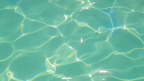 Sun glare on the surface of the blue water of the pool. Stock Footage 114988359
