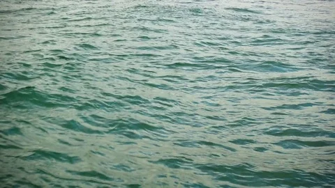 Sun glare on the water surface close-up Video stock 82904944