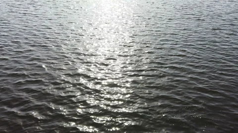 Sun glare on the water surface in the evening sunset. Stock Footage 154370581