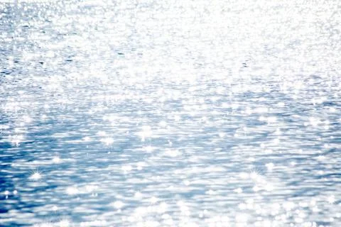 Sun glare on the water surface of the river or sea Stock Photos