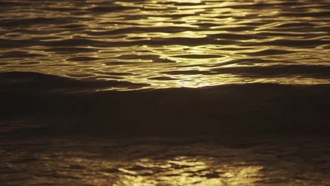 The sun glaring off the ocean at sunset in Hawaii Stock Footage 76235925