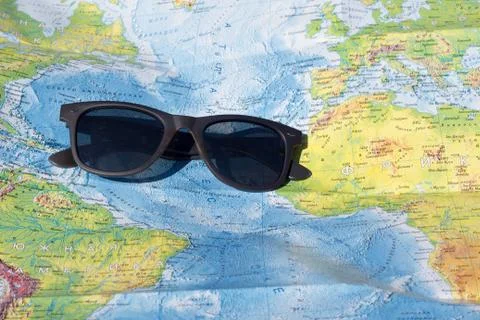 Sun glasses and map Stock Photos