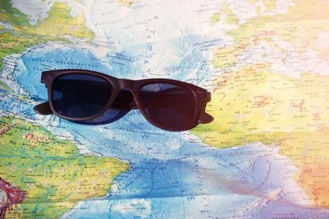 Sun glasses and map Stock Photos
