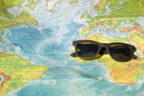 Sun glasses and map Stock Photos