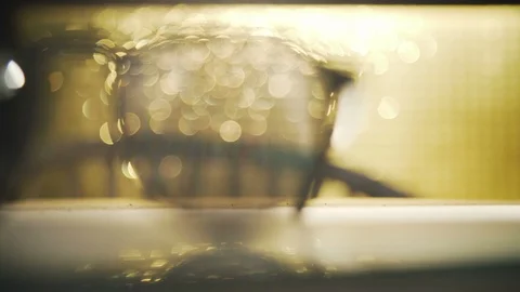 Sun glasses in sunset light focusing from background Stock Footage 102728896